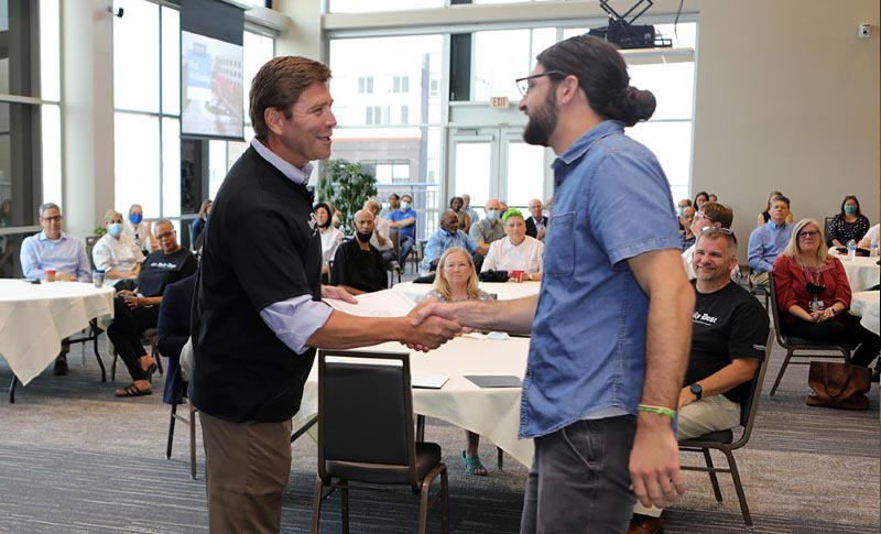 
President Harrison congratulates Staff Employee of the Month Nick Malpezzi.
